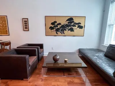 a living room with two couches and a coffee table at Peaceful Zen Getaway in the City in Philadelphia