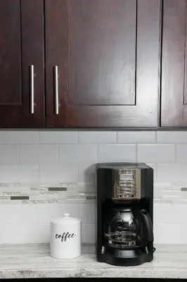 a coffee maker on a counter with a coffee mug at Peaceful Zen Getaway in the City in Philadelphia