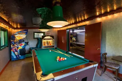 a billiard table in a room with a pinball at Sun Retreats Lancaster County in Narvon