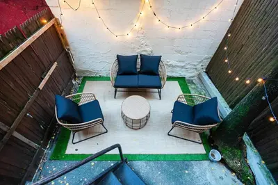 an overhead view of a patio with chairs and a table at 74-1C New Studio With private outdoors - GYM in New York