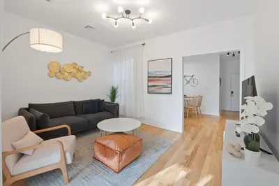 a living room with a couch and a table at Jersey City Monthly Boutique 20 Min to NYC in Jersey City