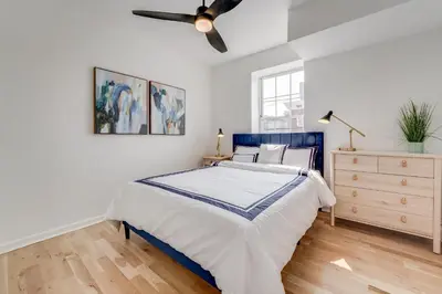 a bedroom with a bed and a ceiling fan at Jersey City Monthly Boutique 20 Min to NYC in Jersey City