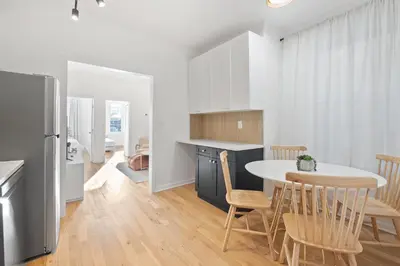 a kitchen and dining room with a table and chairs at Jersey City Monthly Boutique 20 Min to NYC in Jersey City