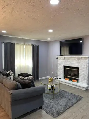 a living room with a couch and a fireplace at Home in Tobyhanna, Poconos Mountain, Pennsylvania in Tobyhanna