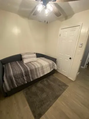 a bedroom with a bed and a ceiling fan at Home in Tobyhanna, Poconos Mountain, Pennsylvania in Tobyhanna