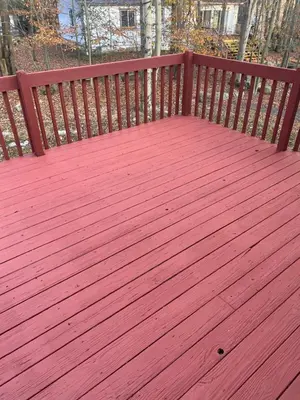 a wooden bench with a red wooden deck at Home in Tobyhanna, Poconos Mountain, Pennsylvania in Tobyhanna