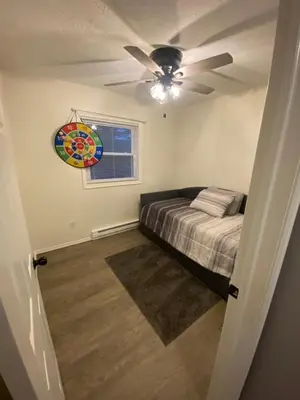 a bedroom with a bed and a ceiling fan at Home in Tobyhanna, Poconos Mountain, Pennsylvania in Tobyhanna