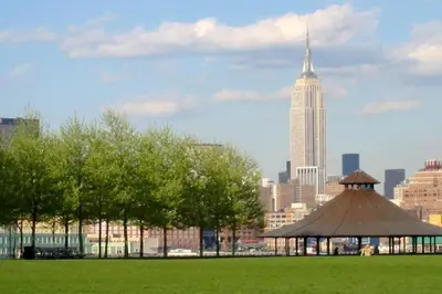 a gazebo in a park with a city skyline at Spacious Oasis - Hoboken California King Bed! in Hoboken