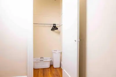 a hallway with a trash can in a room at Spacious Oasis - Hoboken California King Bed! in Hoboken