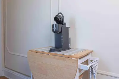 a sewing machine sitting on top of a wooden table at Spacious Oasis - Hoboken California King Bed! in Hoboken