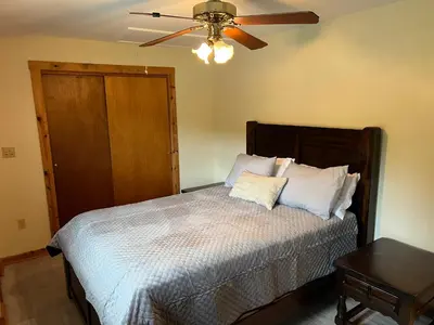 a bedroom with a bed with a ceiling fan at Wellsboro Rail Trail 1 in Wellsboro