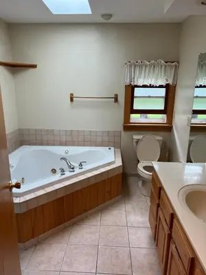 a bathroom with a tub and a toilet and a sink at Wellsboro Rail Trail 1 in Wellsboro