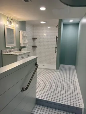 a bathroom with a shower and a sink and a door at Wellsboro Rail Trail 1 in Wellsboro
