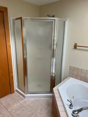 a bathroom with a shower and a tub and a sink at Wellsboro Rail Trail 1 in Wellsboro