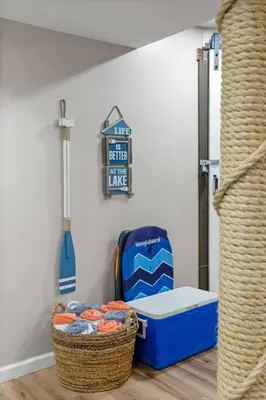 a room with a cooler and a basket of balls at Rustic Luxury in the Pocono Mountains - Stag Lodge in Pocono Lake
