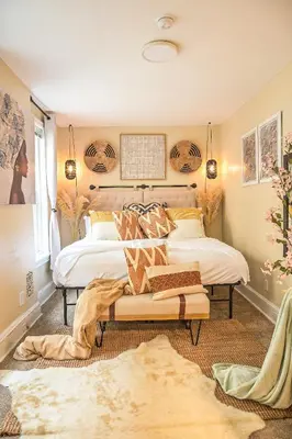 a bedroom with two beds and a bench in it at Chic 4BR Dwelling with Backyard in Philadelphia in Philadelphia