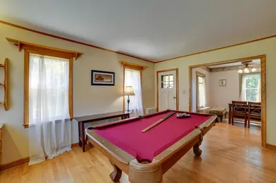 a pool table in the middle of a room at Rustic Bainbridge Retreat with Spacious Yard! in Bainbridge