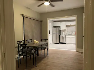a kitchen and dining room with a table and chairs at Little France Phillipsburg in Phillipsburg