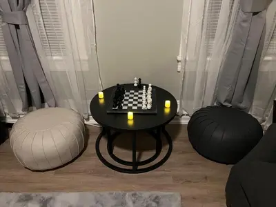 a living room with a chess table and two balls at Little France Phillipsburg in Phillipsburg