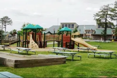 a park with a playground with tables and slides at Magical Waterfront with 4-Season fun in Ski Resort in Lackawaxen