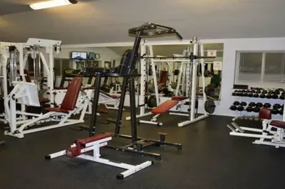 a gym with a lot of equipment in a room at Magical Waterfront with 4-Season fun in Ski Resort in Lackawaxen