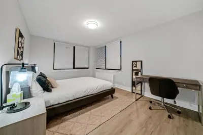 a bedroom with a bed and a desk with a computer at Avenue A821 I Cozy and Comfy Philadelphia stay in Philadelphia