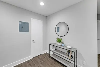 a white room with a mirror and a table at Avenue A821 I Cozy and Comfy Philadelphia stay in Philadelphia