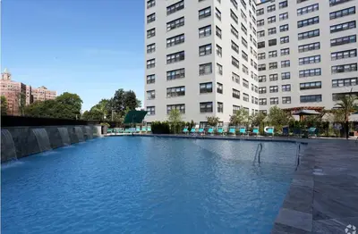a large pool of water in front of two tall buildings at Avenue A821 I Cozy and Comfy Philadelphia stay in Philadelphia