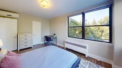 a bedroom with a bed and a large window at Avenue B234 2Bedroom With Pool, Gym, Parking in Philadelphia