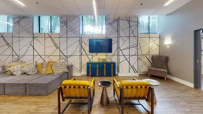a living room with a couch and two chairs at Avenue B234 2Bedroom With Pool, Gym, Parking in Philadelphia