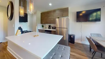 a kitchen with a white counter top and a refrigerator at Avenue B234 2Bedroom With Pool, Gym, Parking in Philadelphia