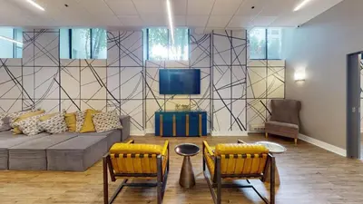 a living room with a couch and two chairs at Avenue A909 Comfy 2Br, Pool, Gym, Parking in Philadelphia