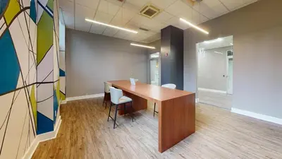 an office room with a wooden table and chairs at Avenue A909 Comfy 2Br, Pool, Gym, Parking in Philadelphia