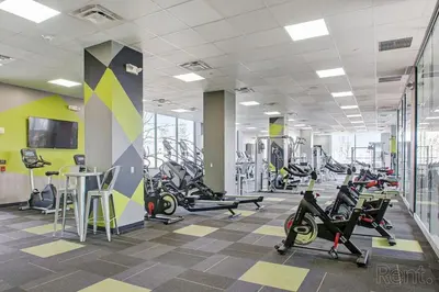 a gym with treadmills and elliptical machines at Avenue A909 Comfy 2Br, Pool, Gym, Parking in Philadelphia