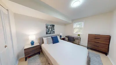 a white bedroom with a bed and a dresser at Pine Brook 804 I Pool Gym I Free Parking ! in Newark
