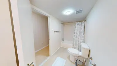 a bathroom with a toilet and a shower at Pine Brook 804 I Pool Gym I Free Parking ! in Newark