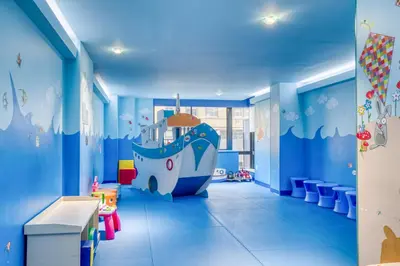 a childrens room with a large blue room with a large boat mural at UWS 2BR w Elevator Gym DM Playroom Rooftop NYC-868 in New York
