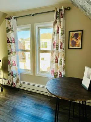 a room with a table and a window at Van Buren Gem 2.0 in Newark