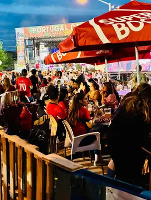 a crowd of people sitting at an outdoor restaurant at Van Buren Gem 2.0 in Newark