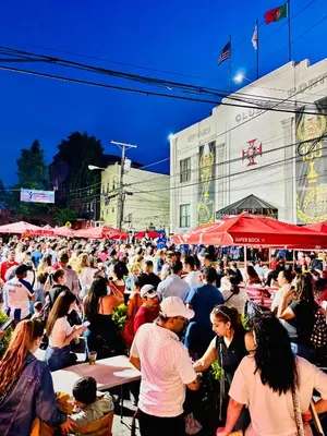 a large crowd of people sitting at tables and umbrellas at Van Buren Gem 2.0 in Newark