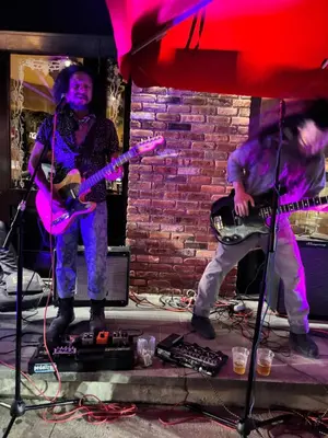 a group of people playing music on a stage at Van Buren Gem 2.0 in Newark