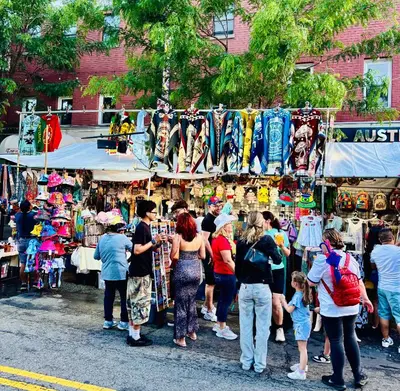 a group of people standing at an outdoor market at Van Buren Gem 2.0 in Newark