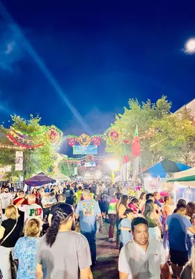 a large crowd of people walking around a festival at Van Buren Gem 2.0 in Newark