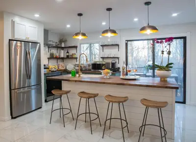 a kitchen with a counter and stools at a bar at Hudson Valley Cottage Rental 3 bedrooms Monroe NY in Monroe