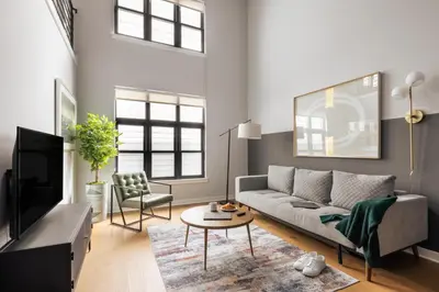 a living room with a couch and a table at Sosuite at The Vine - Old City in Philadelphia