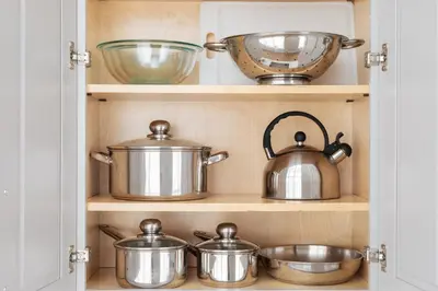 a cupboard with pots and pans in it at Sosuite at The Vine - Old City in Philadelphia