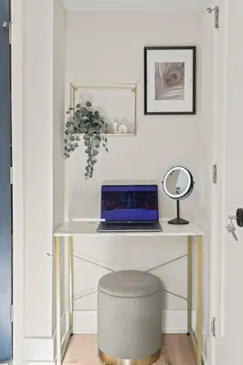 a desk with a laptop computer on top of it at 1 BR Passyunk Ave Stunner- Perfect Location in Philadelphia