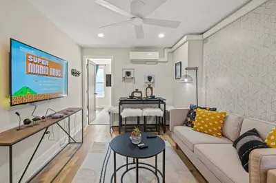 a living room with a couch and a table at 1 BR Passyunk Ave Stunner- Perfect Location in Philadelphia
