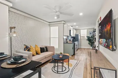 a living room with a couch and a table at 1 BR Passyunk Ave Stunner- Perfect Location in Philadelphia