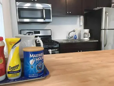 a kitchen with a counter top with a bottle of mayonnaise and a container at Skyline 3BR 20 MIN to T Square #2 in West New York